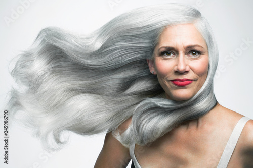 Beautiful Woman With Her Long Silvery Grey Hair Blowing Sideways