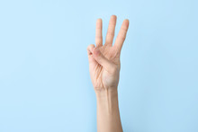 Woman Showing W Letter On Color Background, Closeup. Sign Language
