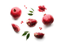 Ripe Pomegranates On White Background, Flat Lay. Delicious Fruit