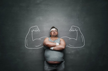 funny sports nerd with huge muscle arms drawn on the gray background with copy space