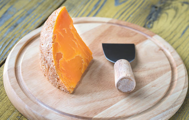 Poster - Mimolette cheese on the wooden board