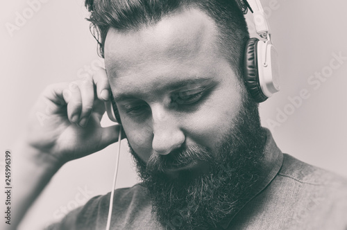 Black And White Portrait Of A Bearded Man With A Stylish Haircut