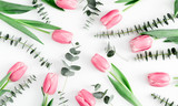 Fototapeta Tulipany - Flowers composition romantic. pink flowers tulips, eucalyptus leaves on white background. Wedding. Birthday. Happy woman's day. Mothers Day. Valentine's Day. Flat lay, top view, copy space