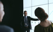 © JonoErasmus - Indian businessman pointing at digital screen during a presentation