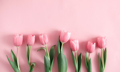 Wall Mural - Flowers composition romantic. Flowers pink tulips on pastel pink background. Wedding. Birthday. Happy woman's day. Mothers Day. Valentine's Day. Flat lay, top view, copy space 