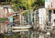 Kids play in a boat in a waterfront slum in Honduras.