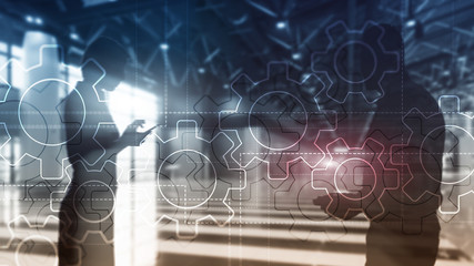Wall Mural - double exposure gears mechanism on blurred background. business and industrial process automation co
