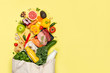 Grocery shopping concept - meat, fish, fruits and vegetables with shopping bag, top view