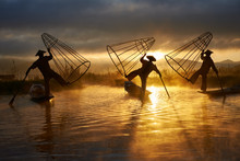Silhouettes Of Three Fishermen On Inle Lake Myanmar