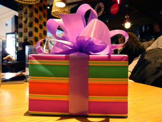 Colorful Gift Box with a Purple Bow