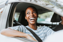 Happy Woman Driving A Car