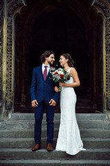 Wall Mural - Newly wed couple on the church steps