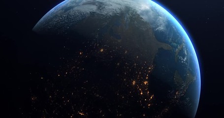 a slow rotation of the earth, as it moves from day to night. earth rotating on its axis in black spa