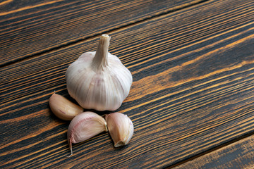 Garlic on wooden background.