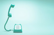 © zendograph - Retro green telephone on teal green background