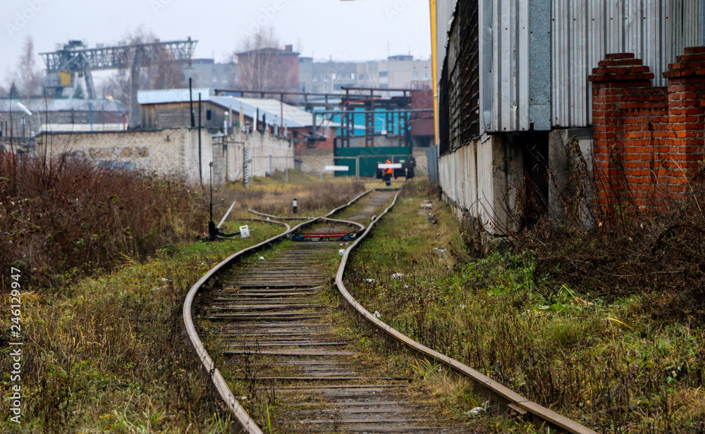 Empty Rails railway in the industrial zone..empty rails with a semaphore, in ...