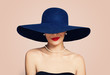 © millaf - Beautiful smiling woman in elegant hat on pink background. Stylish girl with red lips makeup, fashion portrait