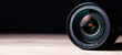 Leinwandbild Motiv camera lens on table