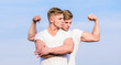 © be free - Men strong muscular athlete bodybuilder posing confidently in white shirts. Sport lifestyle and healthy body. Attractive twins. Handsome strong twins. Men twins muscular brothers sky background