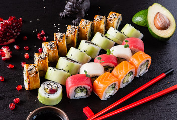 Wall Mural - sushi on the black background