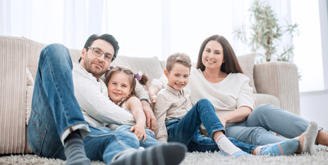 happy family rests in the living room on a free evening