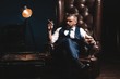 © opolja - Attractive man with cigar and a glass whiskey