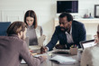 © LStockStudio - Group of Businesspeople at Meeting Room