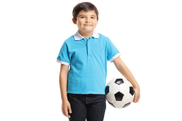 Canvas Print - Smiling young boy holding a soccer ball