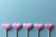 Pink Textile Hearts On Wooden Sticks Closeup. Valentines Day Background, Creative Texture And Love Concept