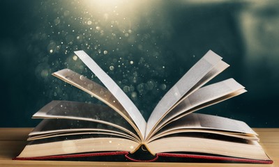 Wall Mural - open book on old wooden table