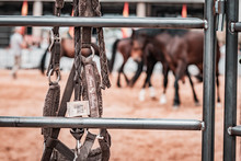 Lovely Crafted Silver And Iron Stirrups And Brown Sand In The Background, American Cowboy Folklore Moments Before Rodeo Performance On New Ranch. Sunny Event, United States National Culture.