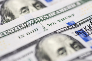 Wall Mural - In god we trust sentence on 100 dollar banknote close up view. In God We Trust from the 100 dollar bill