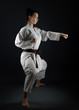 © muro - Young Woman Dressed In Traditional Kimono Practicing Her Karate Moves