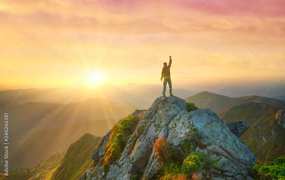 Silhouette of a champion on mountain top. Travel and adventure. Mountain hiking. Mountains during sunrise. Success and goal achievement. People success-image - obrazy, fototapety, plakaty 