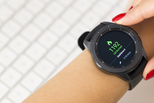 Young Woman Checking Burned Calories On Wearable Smartwatch