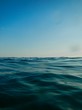  Save Download Preview horizon meets water, ocean rippled water meets sky, seascape of calm water clear sky, cloudless blue sky