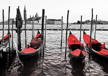 Blue Old Gondolas  Docked At The Pier The Piazza San Marco In Venice, Italy. Color In Black And White