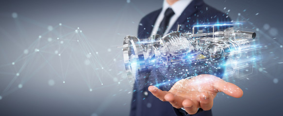 Poster - businessman using wireframe holographic 3d digital projection of an engine