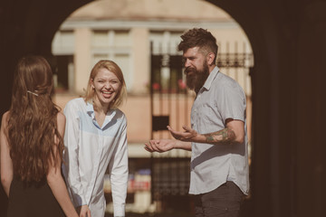 Wall Mural - Its so funny. Friendship begins with smile. Bearded man and pretty women smiling on street. Boyfriend dating girlfriends. People enjoying each others company. Bonds of friendship. Happy friends