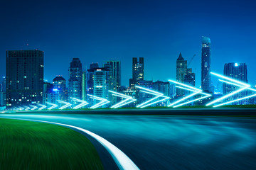 Wall Mural - Motion blurred racetrack,cityscape night scene cold mood. with arrow light Effects.