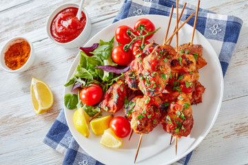 Wall Mural - chicken kebab grilled on skewers, top view