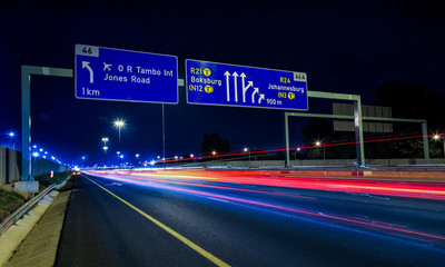 motorway signs on highway at night
