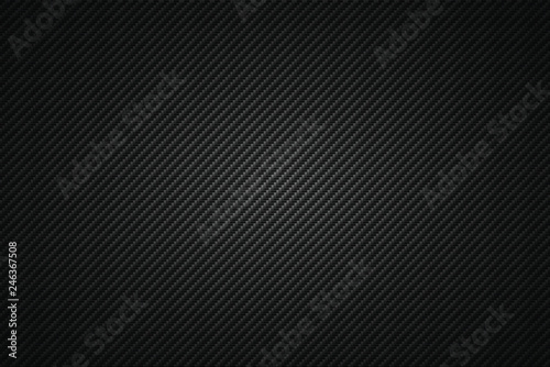 Carbon fiber texture with redial gradient. Vector illustration
