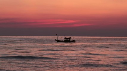 Wall Mural - Fishing boat in the sea at sunset in Thailand