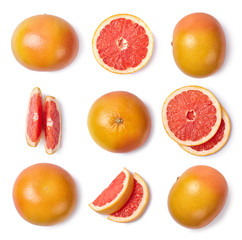 Wall Mural - A set of whole and sliced grapefruit isolated on white background. Top view.