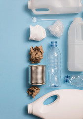 Wall Mural - Top view of rubbish for recycling on a blue background