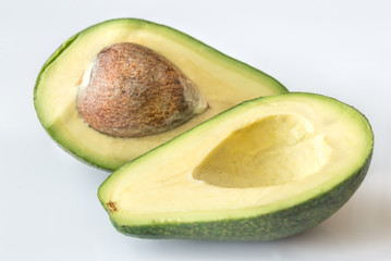 Sticker - Halved avocado on the white background