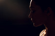 © primipil - Edge lit profile woman portrait.