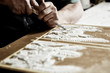 © Christopher - craftsman hands using a gouge to make an intricate carving