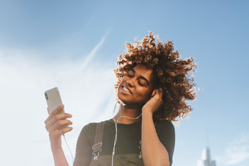 girl listening to music from her phone